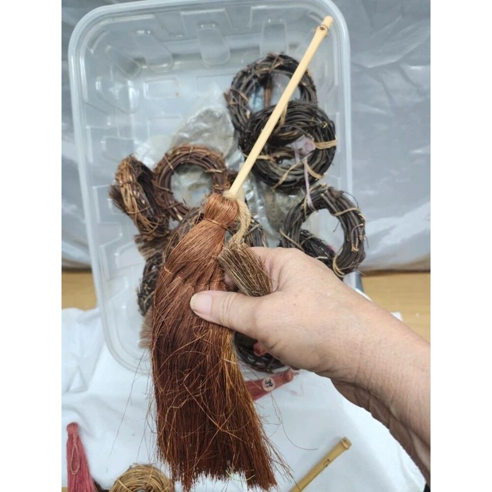 Bundle of mini grape vine wreaths and brooms